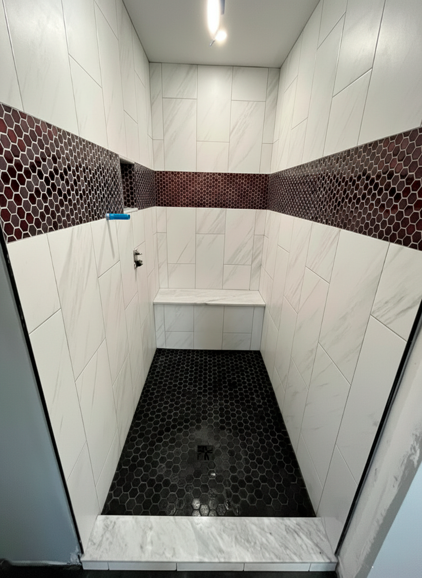 Professional tile installation in Richmond bathroom with decorative wall tiles and modern finish by Break & Build Interiors